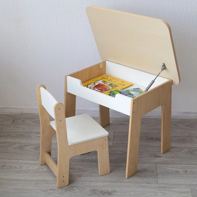 Biały drewniany stolik i krzesełko dziecięce z otwartą wnęką do przechowywania kredek i książek
